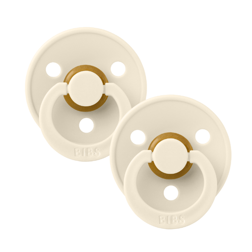 Pair of ivory BIBS baby pacifiers sold by Meridian Baby.