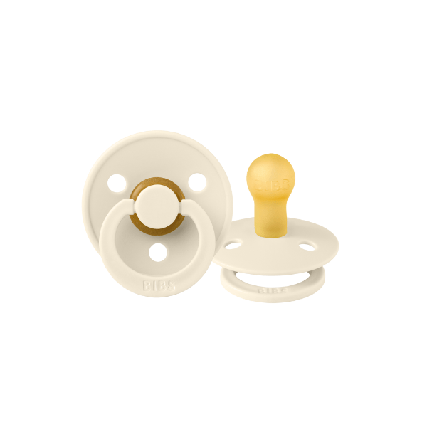 Front and back view of ivory BIBS baby pacifiers sold by Meridian Baby.