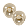 Pair of beige BIBS baby pacifiers sold by Meridian Baby.