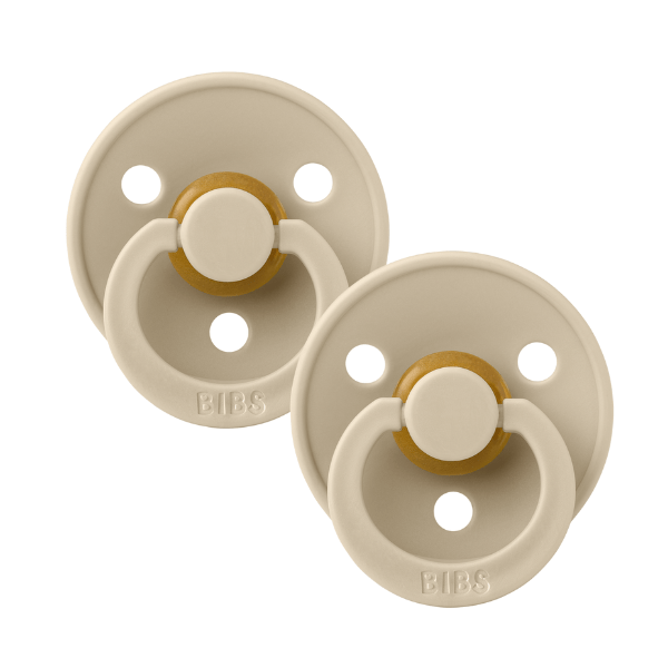 Pair of beige BIBS baby pacifiers sold by Meridian Baby.