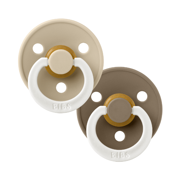 Vanilla and Dark Oak BIBS baby pacifiers sold by Meridian Baby.