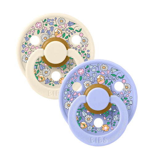 Two BIBS Liberty floral baby pacifiers sold by Meridian Baby.