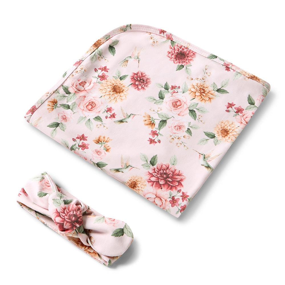 Snuggle Hunny pink floral baby wrap and matching headband from Meridian Baby.