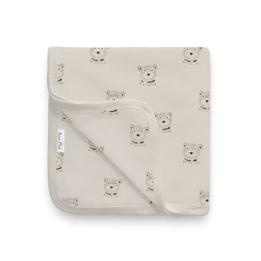 Aster & Oak beige baby blanket with byron bear pattern from Meridian Baby