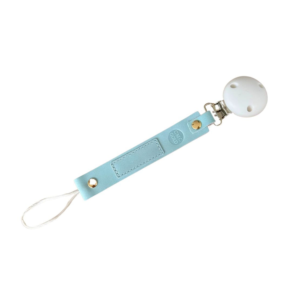 CMC Gold Light blue pacifier clip with a white round silicone clip sold by Meridian Baby