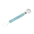 CMC Gold Light blue pacifier clip with a white round silicone clip sold by Meridian Baby
