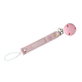 Pink CMC Gold pacifier clip with a round pink silicone clip sold by Meridian Baby