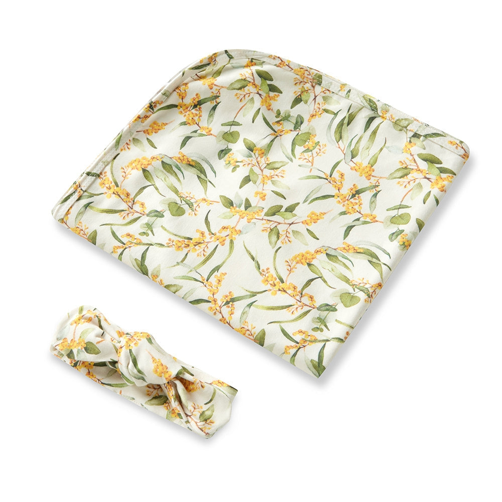 Snuggle Hunny baby swaddle with golden wattle print from Meridian Baby