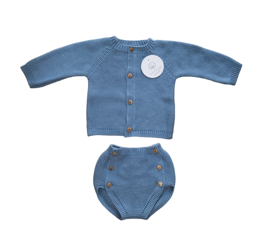 Blue knitted baby cardigan and diaper set on a white background