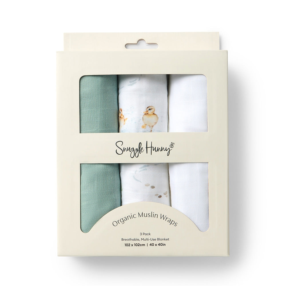 Pack of organic muslin wraps by Snuggle Hunny with a white and green design on a beige background.