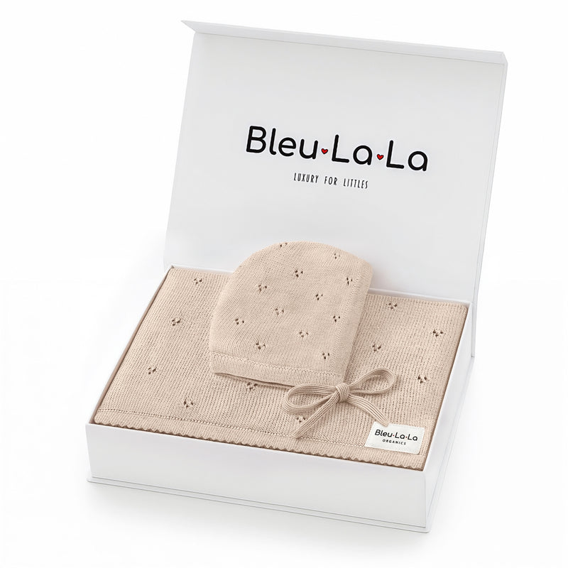 Baby blanket and hat set in a 'Bleu La La' packaging on a white background