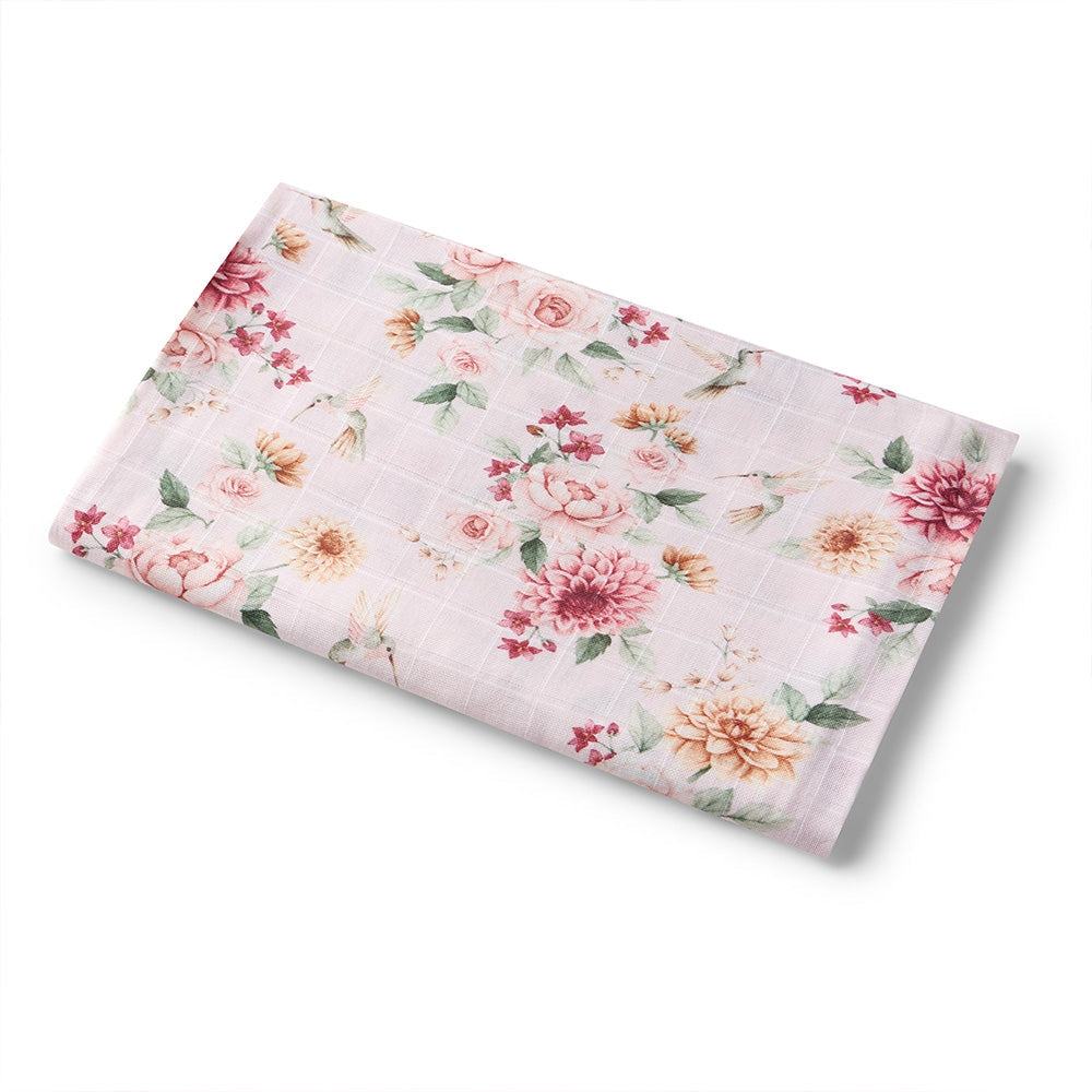 Floral patterned muslin wrap on a white background
