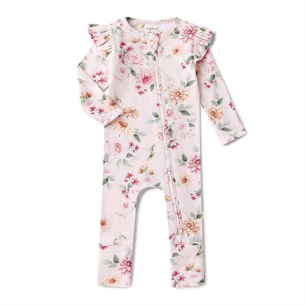 Floral baby romper with ruffled shoulders on a white background