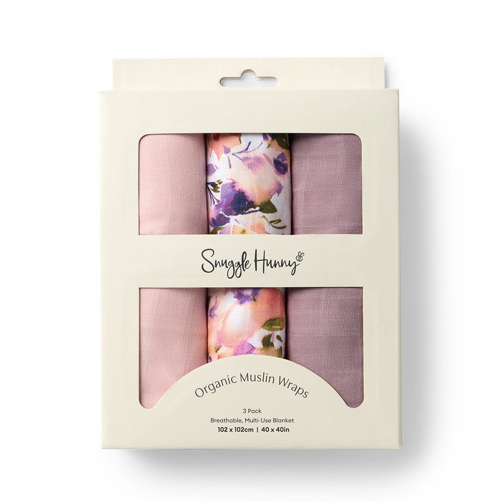 Pack of organic muslin wraps with floral design in packaging, brand 'Snuggle Hunny' visible.