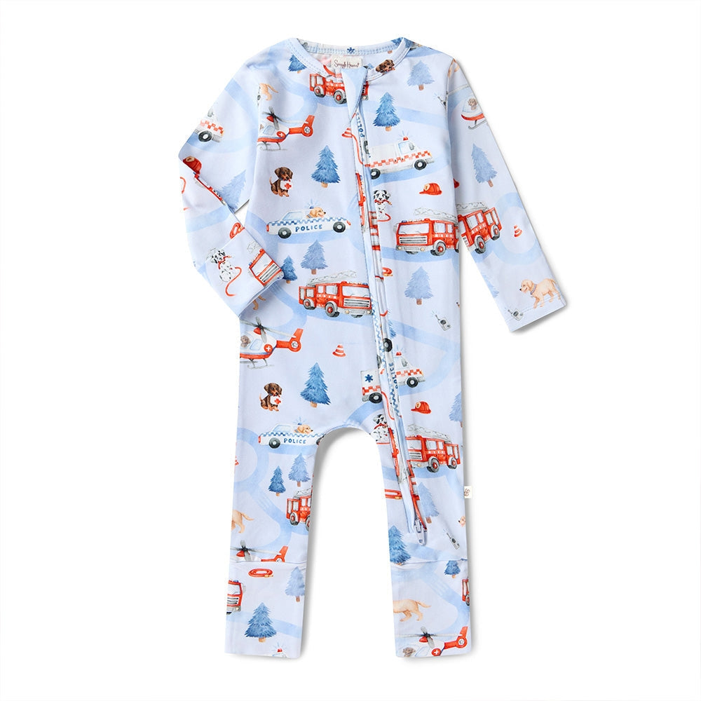 Baby onesie with fire truck and dog pattern on a light blue background